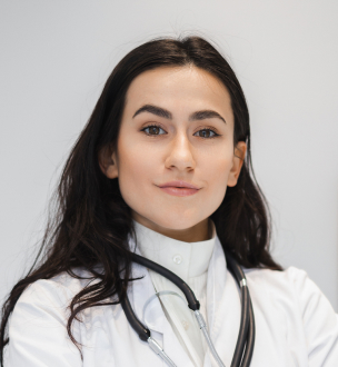 portrait-of-female-doctor-in-lab-coat-standing-wit-2024-10-18-08-21-05-utc-1.jpg
